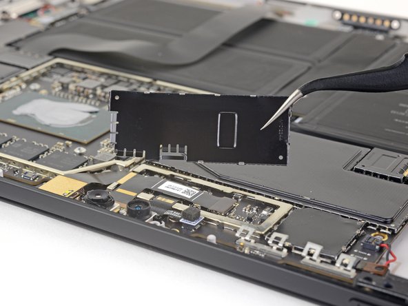 Microsoft Surface Pro 5 Rear-Facing Camera Replacement, Remove the camera connector shield: crwdns2935265:031crwdnd2935265:03crwdnd2935265:03crwdne2935265:0