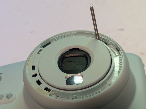 Fujifilm Instax Mini 9 Camera Shell Replacement, Disconnect the Brightness Adjustment Dial Return Spring: crwdns2935265:09crwdnd2935265:03crwdnd2935265:03crwdne2935265:0