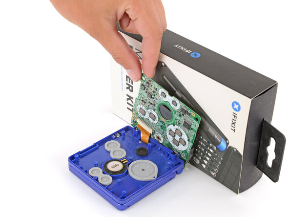 Nintendo Game Boy Advance SP Buttons Replacement, Prop up the motherboard: crwdns2935265:011crwdnd2935265:03crwdnd2935265:03crwdne2935265:0