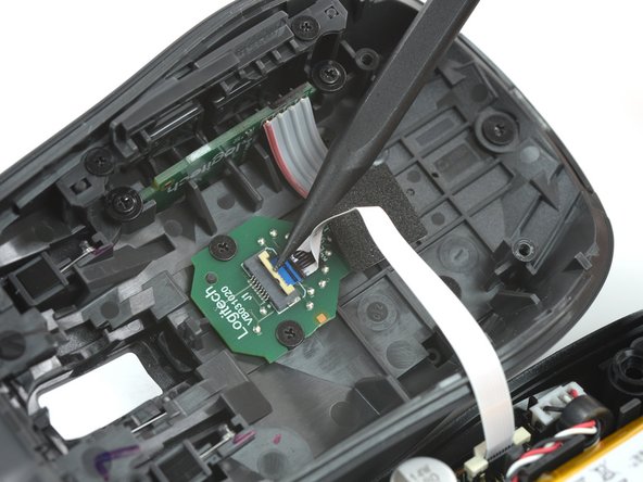 How to Open Your Logitech MX Anywhere 3, Disconnect the interconnect cable: crwdns2935265:07crwdnd2935265:02crwdnd2935265:02crwdne2935265:0