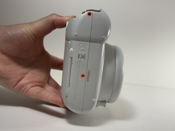 Fujifilm Instax Mini 9 Flash Capacitor Replacement, Remove Shell Screws: crwdns2935265:04crwdnd2935265:02crwdnd2935265:03crwdne2935265:0