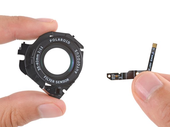 Polaroid Now Gen 3 Outer Lens Replacement, Compare your replacement part: crwdns2935265:031crwdnd2935265:02crwdnd2935265:02crwdne2935265:0