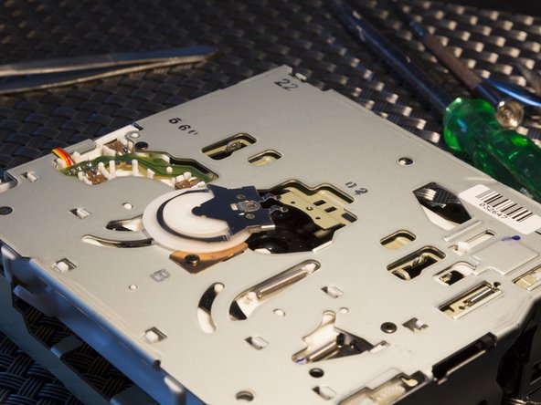 Audi Navigation Plus CD-ROM Drive Lens Cleaning, Removing disk clamb: step 3, image 3 of 3