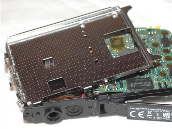 Repairing Casio Exilim EX-Z350 Lens mechanics, Remove metal frame bracket (2): crwdns2935265:09crwdnd2935265:02crwdnd2935265:03crwdne2935265:0