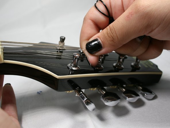 How to Replace the Strings on your Rogue RM-100A A-Style Mandolin: step 4, image 2 of 2