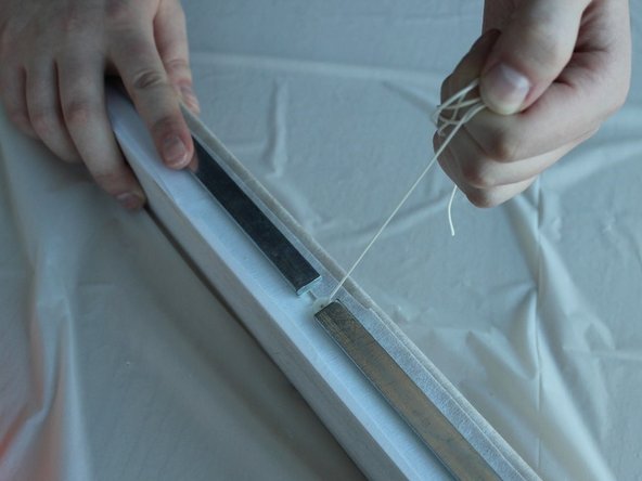 Pull the strings out of the shade and discard.