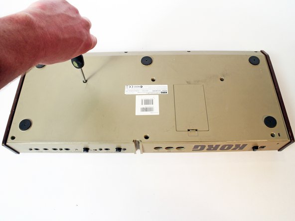 Korg MicroKORG Key Contact Strip Repair, Remove Back Cover: step 3, image 1 of 2