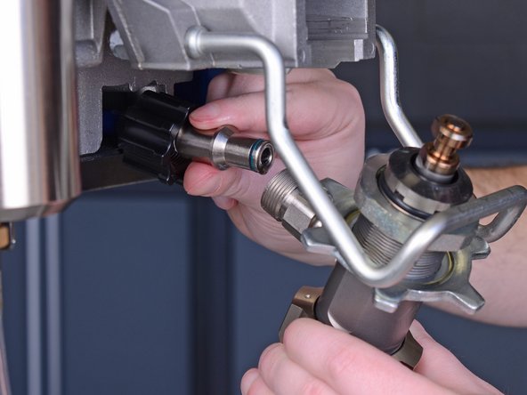 Remove the pump from the paint sprayer.