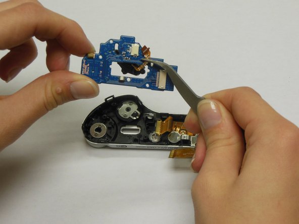 Samsung NX300 Jog and Mode Dial Replacement, Remove the Connecting Ribon: crwdns2935265:09crwdnd2935265:02crwdnd2935265:03crwdne2935265:0