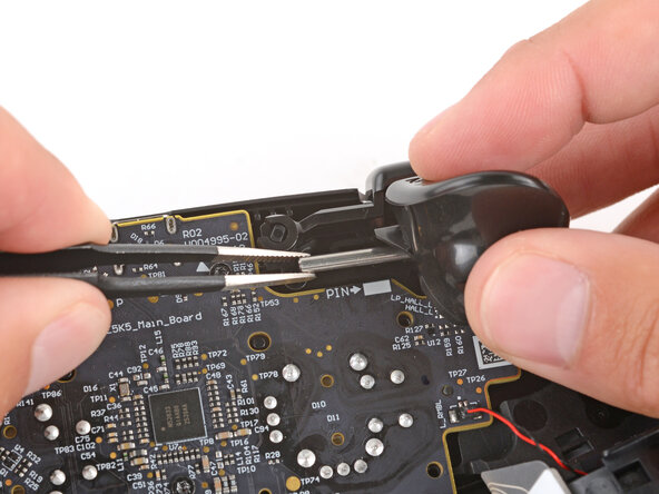 Steam Controller (2nd Gen, 2026) Left Trigger Replacement, Remove the hinge pin: step 7, image 2 of 3