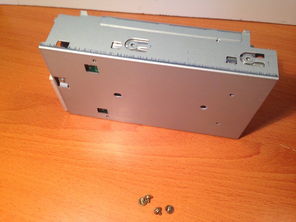 Apple 3.5 Drive External Floppy Drive Teardown, Unscrewing the Floppy Mechanism From Chassis: crwdns2935265:08crwdnd2935265:03crwdnd2935265:03crwdne2935265:0