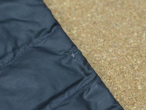 Repair small tear on sale in down jacket