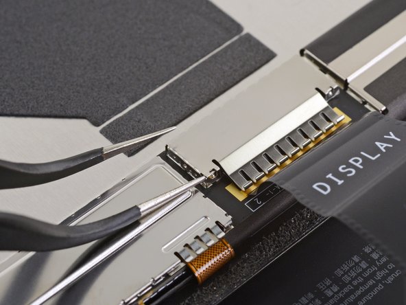 Microsoft Surface Pro X Screen Replacement, Remove the display cable shield: crwdns2935265:016crwdnd2935265:02crwdnd2935265:03crwdne2935265:0