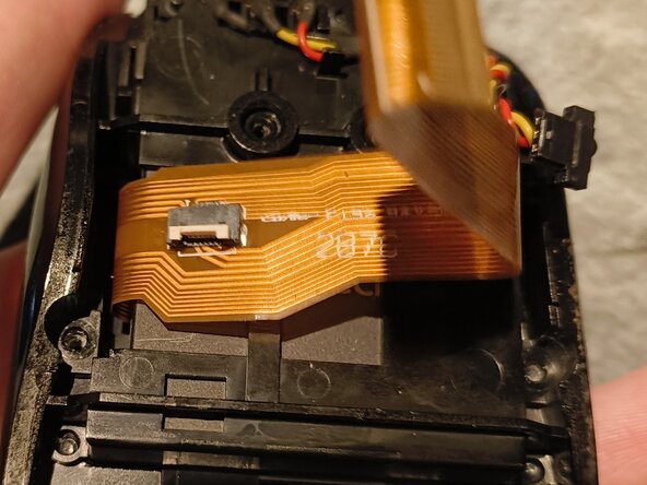 Logitech MX Air Battery Replacement, Unscrew, then disconnect another ribbon cable, and lift one up: crwdns2935265:05crwdnd2935265:03crwdnd2935265:03crwdne2935265:0