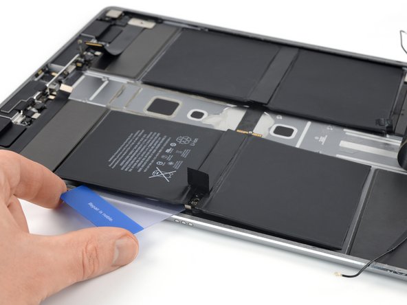 iPad Pro 12.9" 2nd Gen Battery Replacement, Lift the left half of the battery: crwdns2935265:073crwdnd2935265:03crwdnd2935265:03crwdne2935265:0