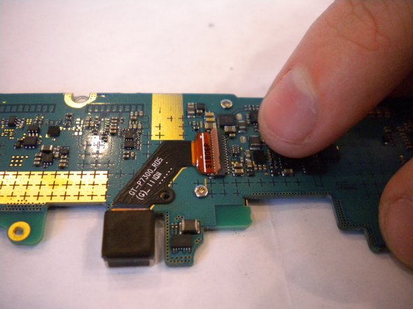 Samsung Galaxy Tab 8.9 Rear Facing Camera Replacement, Disconnect Flex Ribbon: crwdns2935265:011crwdnd2935265:03crwdnd2935265:03crwdne2935265:0