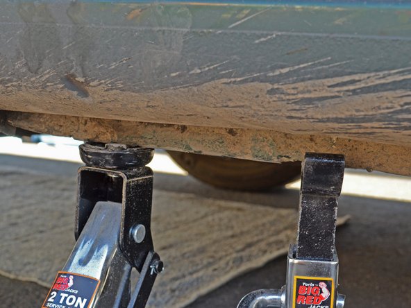 Place your jack back in the same location on the frame you used to jack up the car. Raise the jack until it touches the jacking point on the frame.