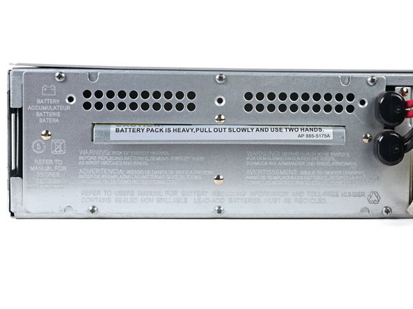 APC Smart-UPS SMT1500RM2UC Battery Cartridge Replacement, Unfasten the battery cartridge: crwdns2935265:06crwdnd2935265:02crwdnd2935265:02crwdne2935265:0