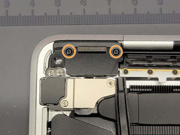 MacBook Pro 13" Two Thunderbolt Ports 2020 Touchbar Removal, Removing Left Hinge Cover: crwdns2935265:011crwdnd2935265:02crwdnd2935265:03crwdne2935265:0