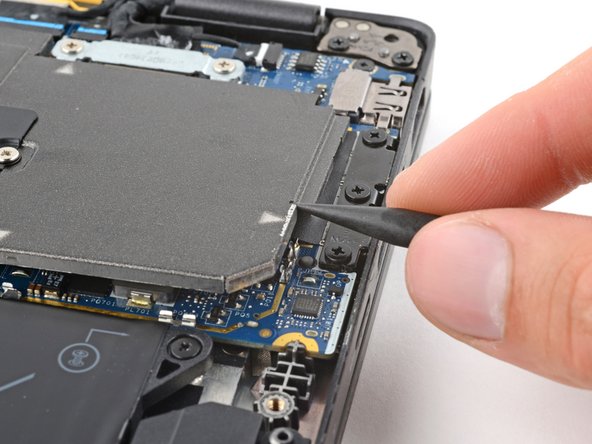 Dell Latitude 7410 Heatsink Replacement, Unclip the heatsink shield: crwdns2935265:014crwdnd2935265:03crwdnd2935265:03crwdne2935265:0