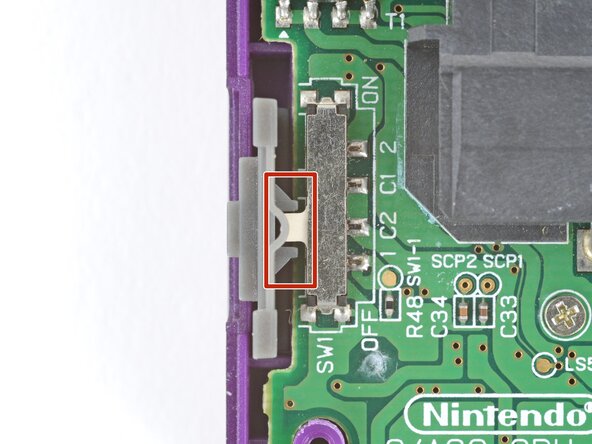 How to Reshell Your Game Boy Advance SP, Install the power switch cover: crwdns2935265:061crwdnd2935265:03crwdnd2935265:03crwdne2935265:0