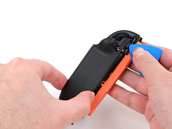 Joy-Con 2 (Right) Joystick Replacement, Install the back cover: crwdns2935265:046crwdnd2935265:02crwdnd2935265:03crwdne2935265:0