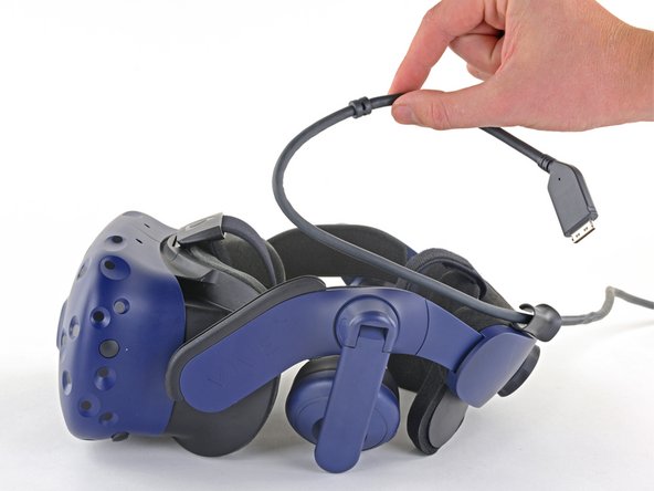 HTC Vive Pro Outer Shell Replacement, Unplug the All-In-One Cable: crwdns2935265:01crwdnd2935265:02crwdnd2935265:03crwdne2935265:0