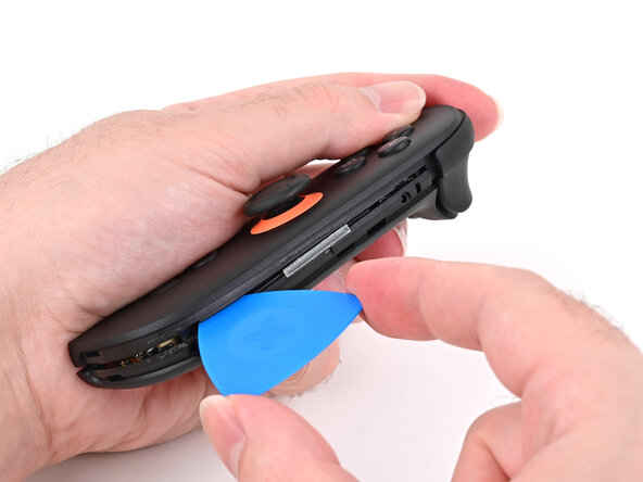 Joy-Con 2 (Right) Joystick Replacement, Insert an opening pick: crwdns2935265:07crwdnd2935265:02crwdnd2935265:02crwdne2935265:0