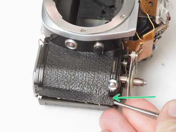 Pentax Super Program Front Lens Board Removal, Remove front leatherette panels: crwdns2935265:07crwdnd2935265:03crwdnd2935265:03crwdne2935265:0