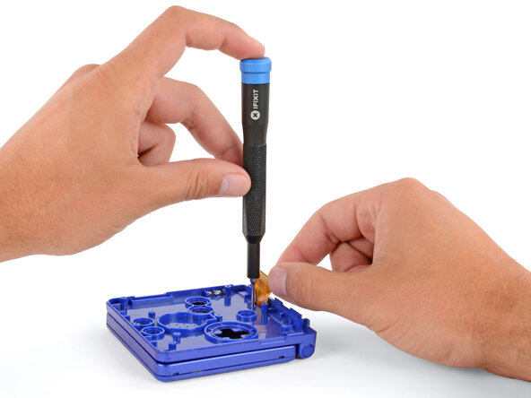 How to Reshell Your Game Boy Advance SP, Remove the hinge cover screw: crwdns2935265:022crwdnd2935265:03crwdnd2935265:03crwdne2935265:0