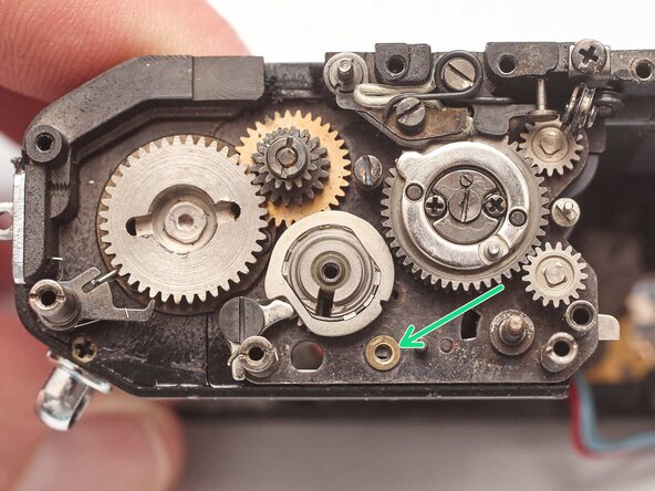 Pentax MX Shutter Assembly Removal, Remove lower transport gear latch: step 29, image 2 of 2