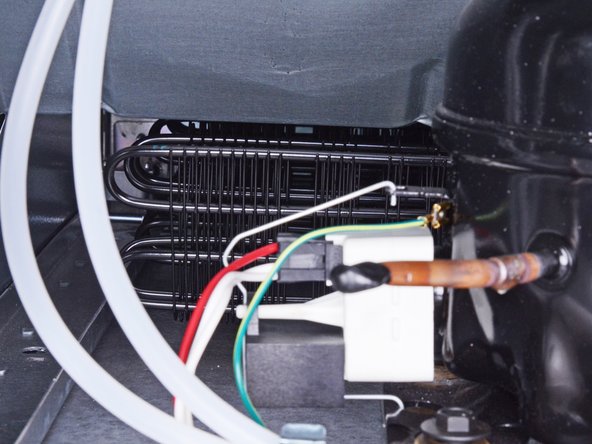 How to Clean the Condenser Coils in your Whirlpool Refrigerator, Vacuum the condenser coils: crwdns2935265:07crwdnd2935265:02crwdnd2935265:02crwdne2935265:0