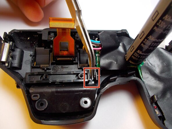 Fujifilm FinePix S2980 Flash Mechanism Latch Spring Replacement: step 7, image 1 of 1
