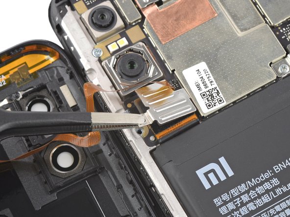 Xiaomi Redmi Note 6 Pro Battery Replacement, Remove the metal cover: crwdns2935265:09crwdnd2935265:02crwdnd2935265:03crwdne2935265:0