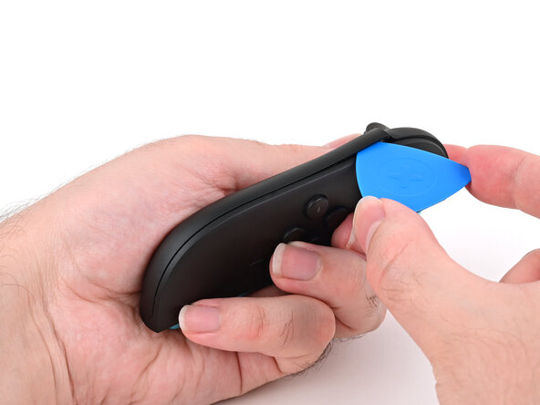 Joy-Con 2 (Left) Battery Replacement, Separate the plastic strip: crwdns2935265:03crwdnd2935265:01crwdnd2935265:03crwdne2935265:0