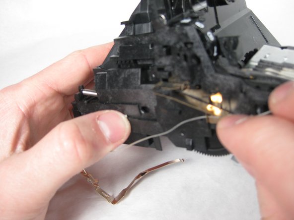 Remove the metal spring tab next to the counter