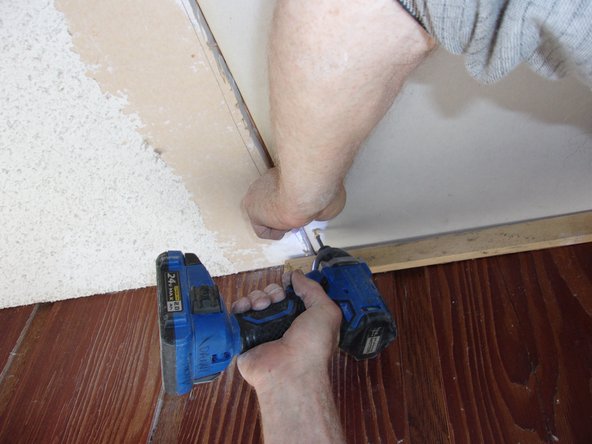 Continue to support the new piece until at least three screws firmly attach the new piece to the middle rafter.