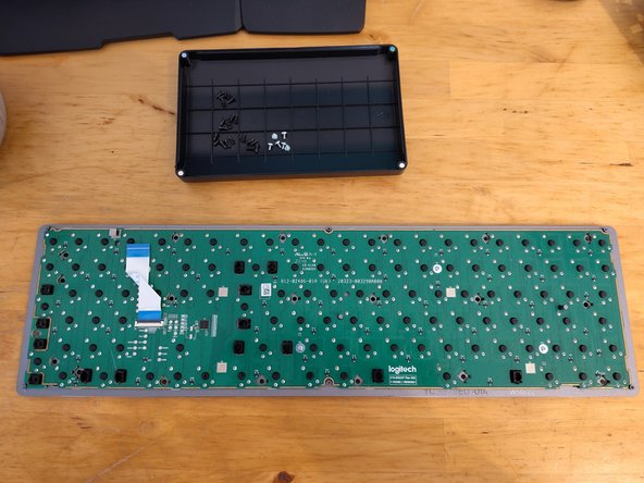 Disassembling Logitech MX Mechanical, Remove plastic frame above PCB: crwdns2935265:04crwdnd2935265:03crwdnd2935265:03crwdne2935265:0