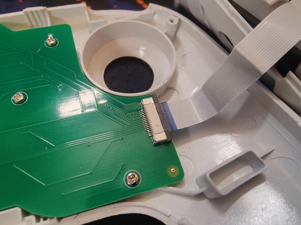 Disassembling 8BitDo Ultimate Bluetooth Controller, Detatch the ribbon cable: crwdns2935265:03crwdnd2935265:01crwdnd2935265:03crwdne2935265:0