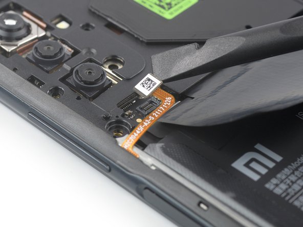 Xiaomi Redmi Note 10 5G Screen Replacement, Disconnect the power and volume button flex cable: crwdns2935265:013crwdnd2935265:02crwdnd2935265:02crwdne2935265:0