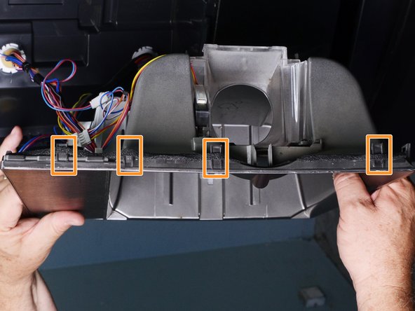 LG Refrigerator Water Dispensing Switch Testing and Replacement, Retaining clip locations: crwdns2935265:04crwdnd2935265:02crwdnd2935265:03crwdne2935265:0