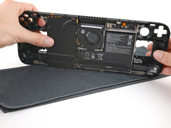 Steam Deck OLED Front Shell Replacement, Flip over the Steam Deck OLED: crwdns2935265:085crwdnd2935265:02crwdnd2935265:03crwdne2935265:0