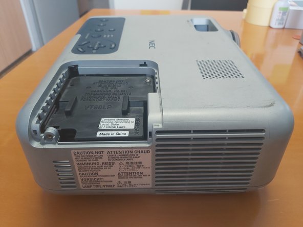 Projector NEC VT660 Disassembly, Remove lamp cover: crwdns2935265:01crwdnd2935265:02crwdnd2935265:02crwdne2935265:0