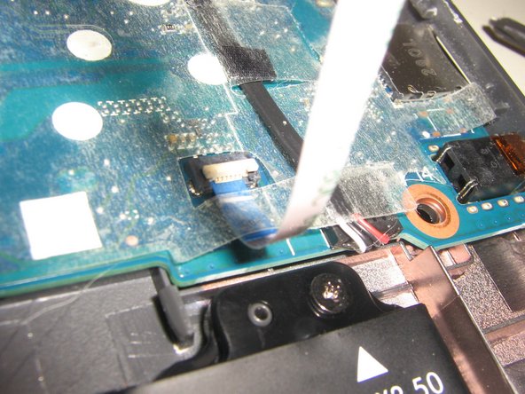HP Chromebook 14-db0000 Battery Replacement, Disconnect Trackpad Ribbon Cable: step 3, image 2 of 3