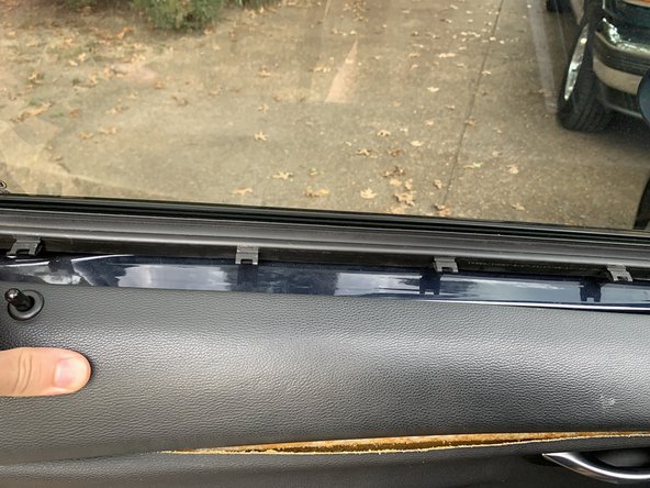 Pull the door panel straight out along the top edge.