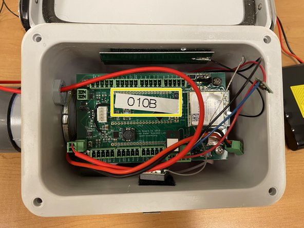 GI Node with Pressure Transducer Assembly, Applying Open-Storm and Node ID stickers: step 31, image 3 of 3