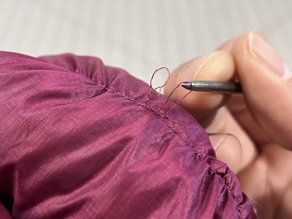 Release a Snagged Stitch on an Insulated Jacket, Release the thread loop: crwdns2935265:03crwdnd2935265:02crwdnd2935265:03crwdne2935265:0
