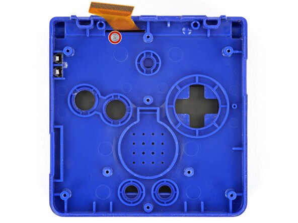 How to Reshell Your Game Boy Advance SP, Remove the hinge cover screw: crwdns2935265:022crwdnd2935265:01crwdnd2935265:03crwdne2935265:0