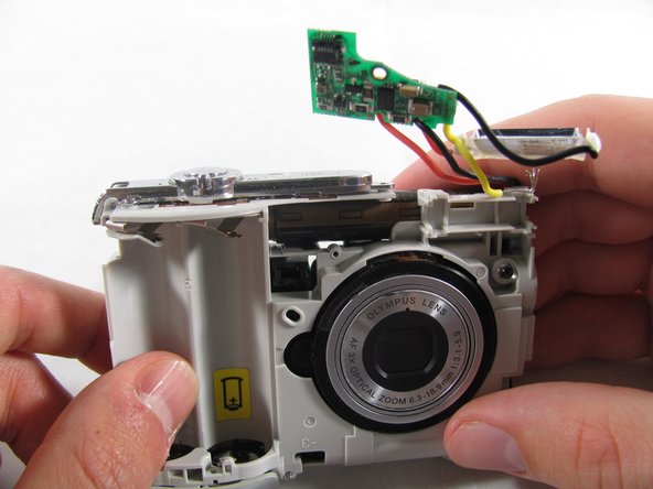 Removing Olympus FE-210 Flash Assembly: crwdns2935265:010crwdnd2935265:03crwdnd2935265:03crwdne2935265:0