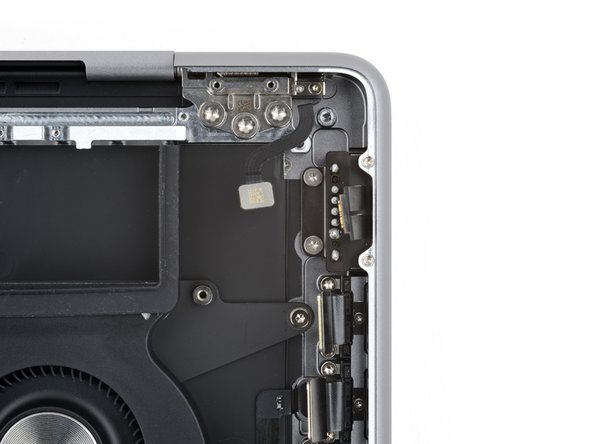 MacBook Pro 14" Late 2023 (M3) MagSafe Port Replacement, Unfasten the MagSafe port: crwdns2935265:053crwdnd2935265:02crwdnd2935265:03crwdne2935265:0